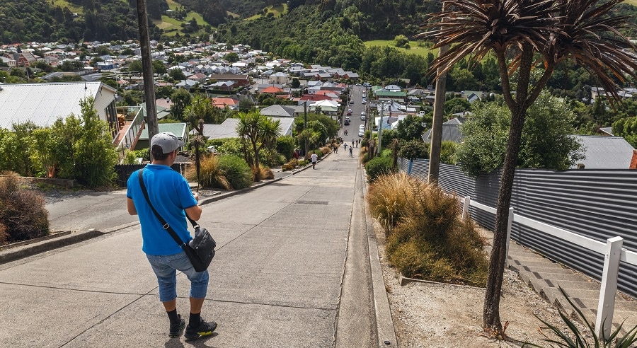 Man at the top of Baldwin Street, Dunedin, New Zealand