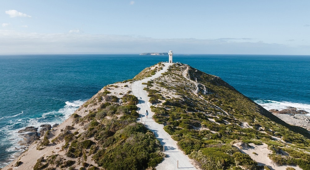 Cape Spencer Lighthouse with sea in background.