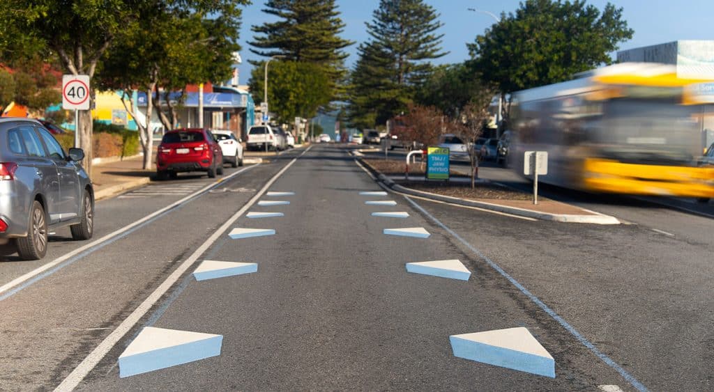 Picture of blue and white 3D dragon teeth painted on a section of an Adelaide road