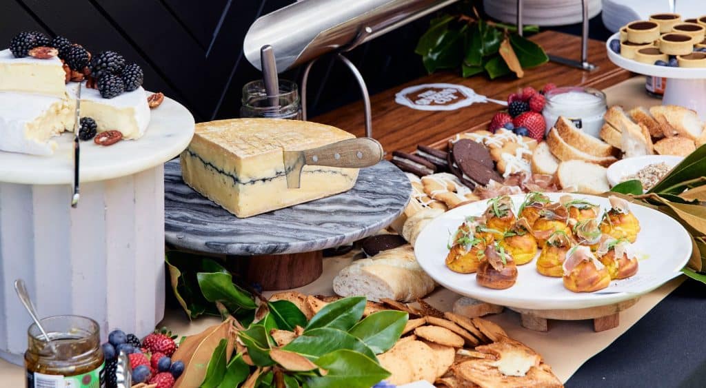 Spread of cheeses and sweets.