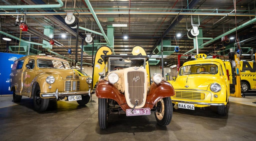 Classic cars on display in a workshop