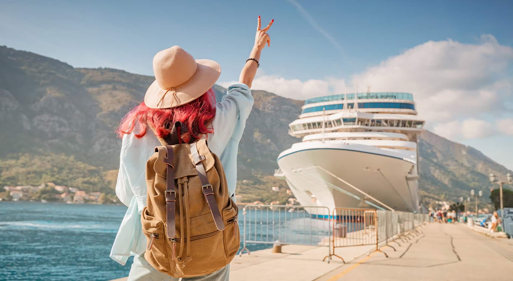 tourist waving to a cruise ship Five tips for first-time cruisers | sa move The RAA Magazine