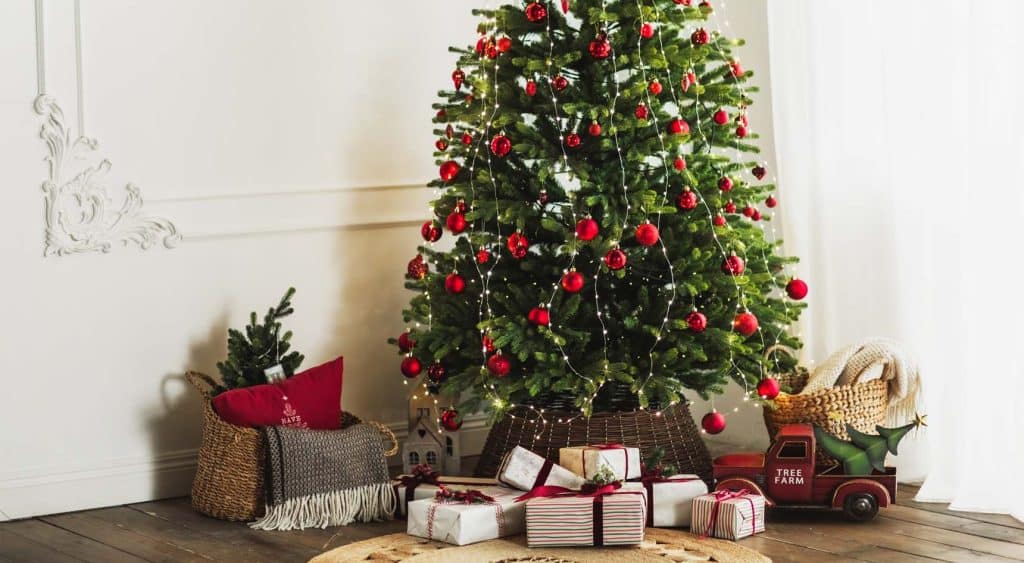 Christmas gifts underneath a Christmas tree.