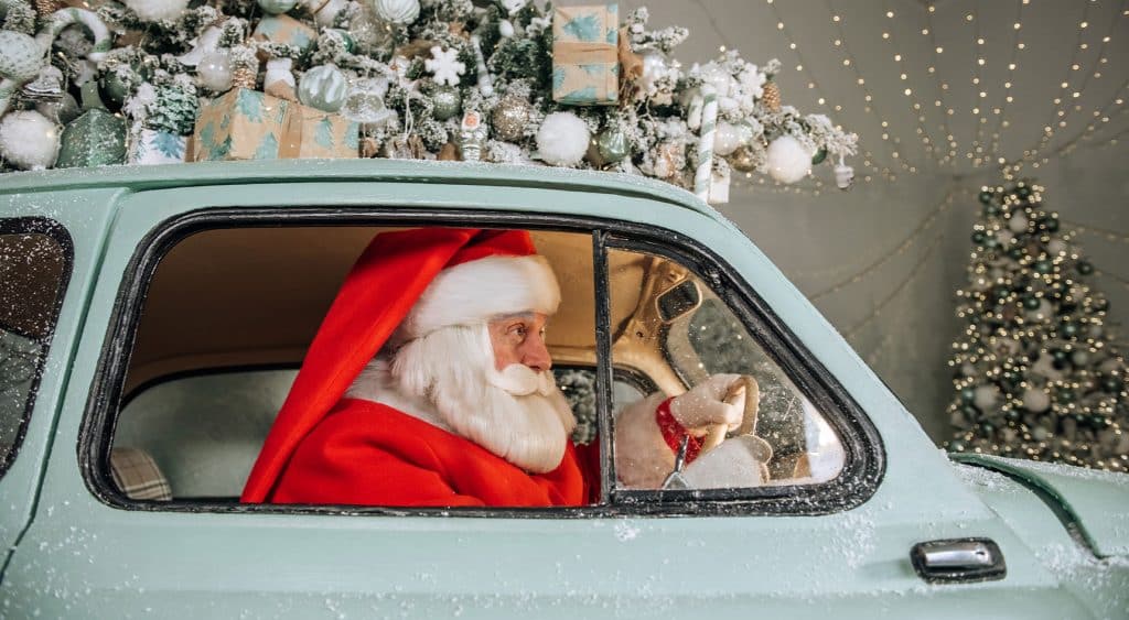 Father Christmas driving a car