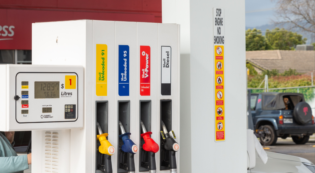 Petrol pump with sign that reads, 'Stop Engine'.