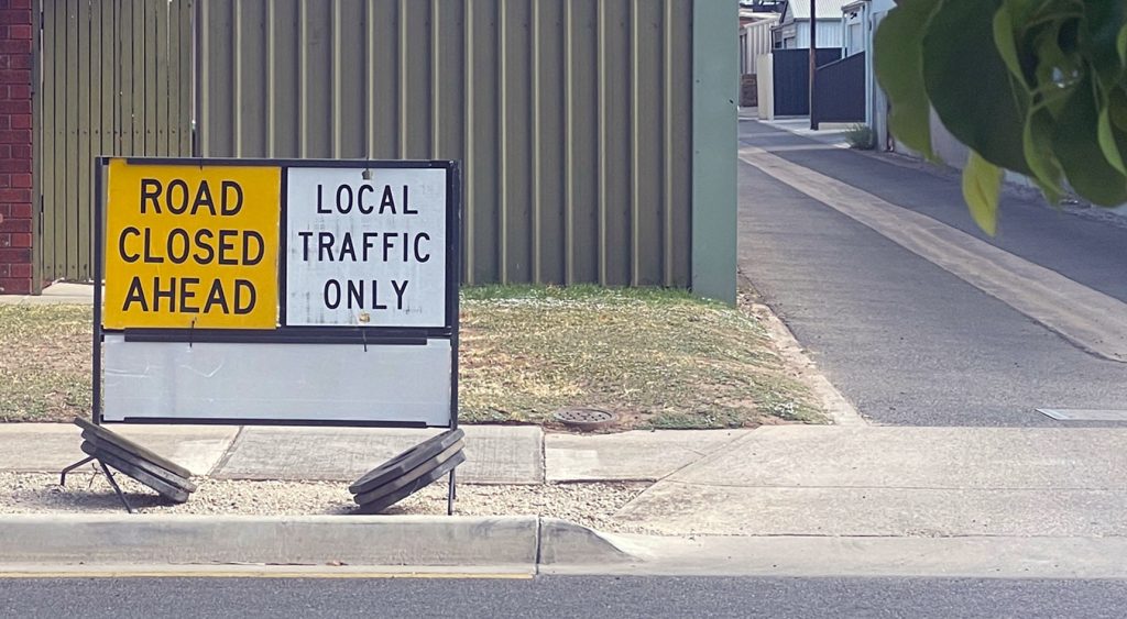 Sign saying Local Traffic Only and Road Closed Ahead