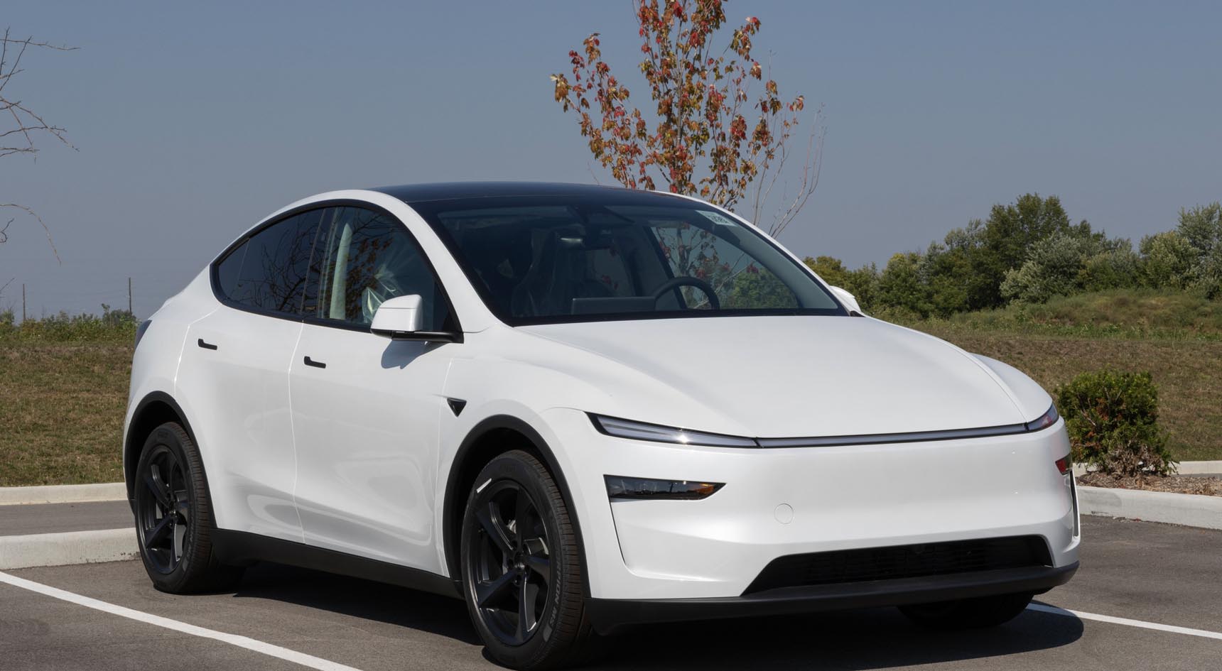 A Tesla Model Y in a car park.