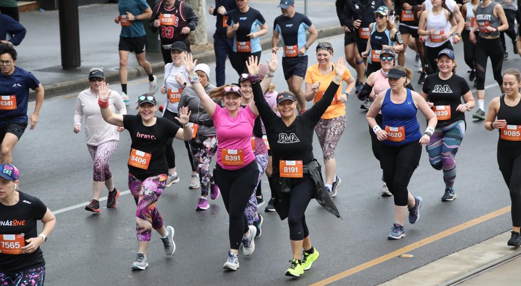 Participants smiling to the camera.
