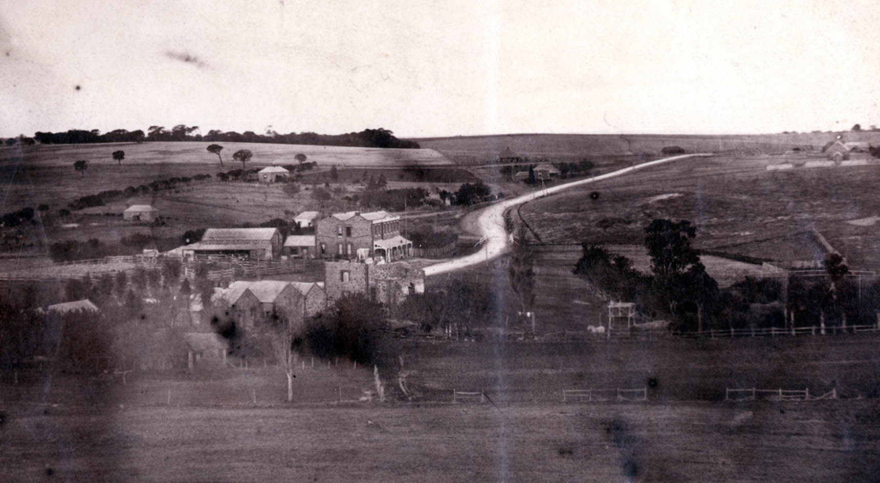 An old photo of Reynella in the 1870s with the ruins of the mill in shot along with the Crown Inn.